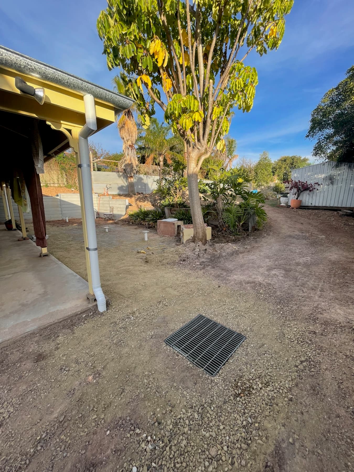 Completed sump installation with surface grates in Burnside patio area