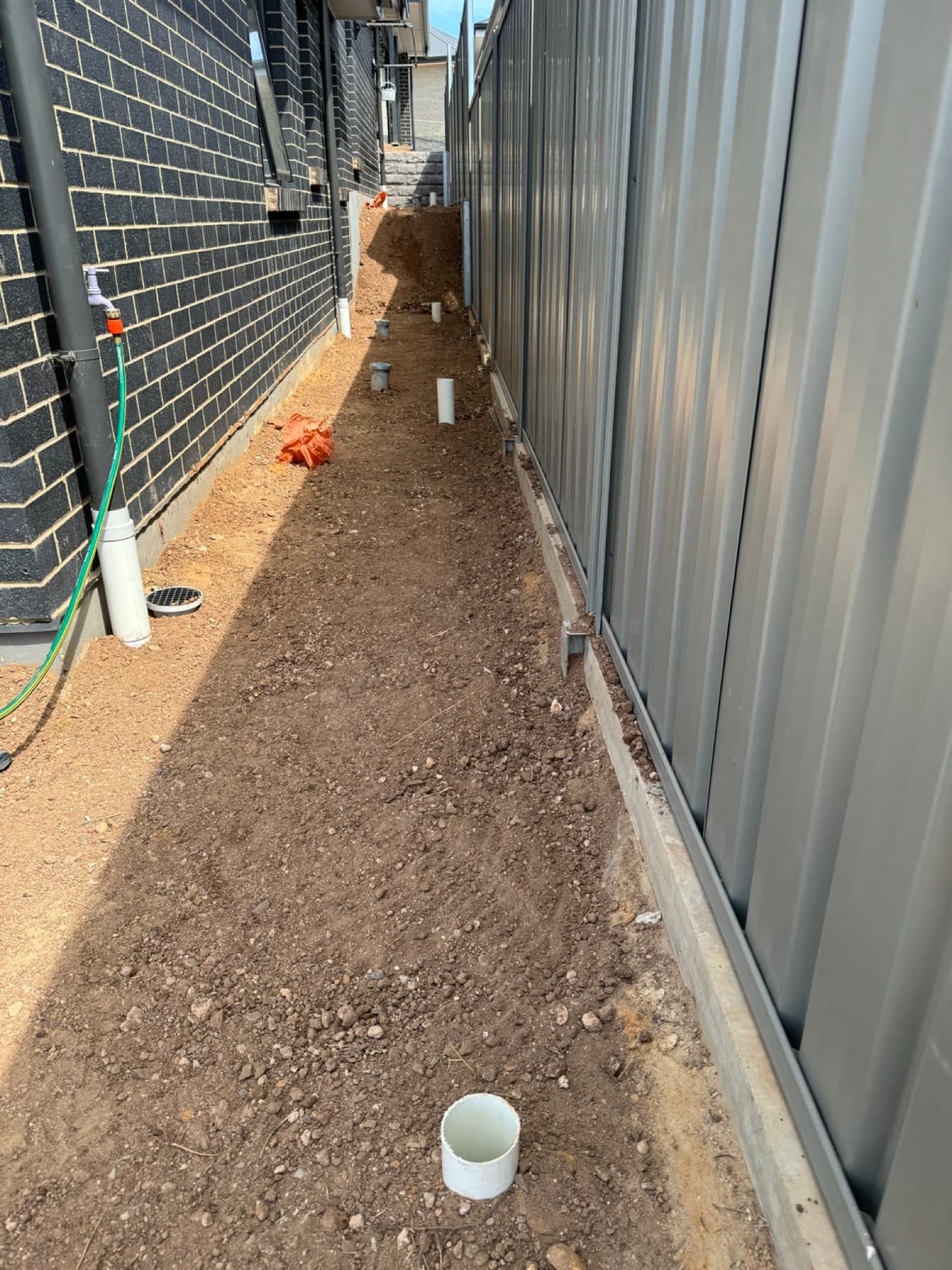 Downpipes connected to rainwater system with surface drains in Norwood